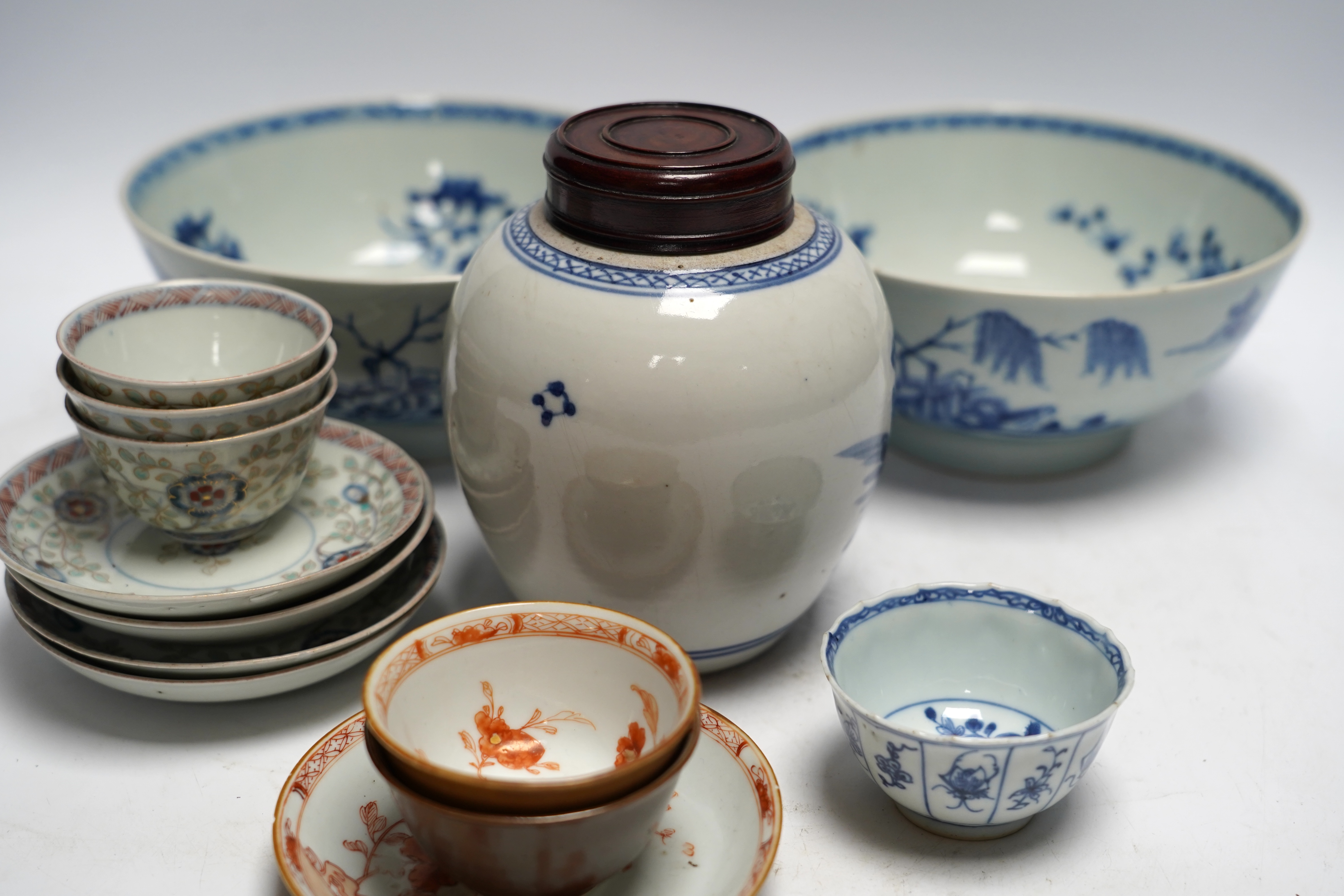 A group of 18th century Chinese and Japanese porcelain including blue and white bowls and jar with hardwood cover, largest 19cm in diameter